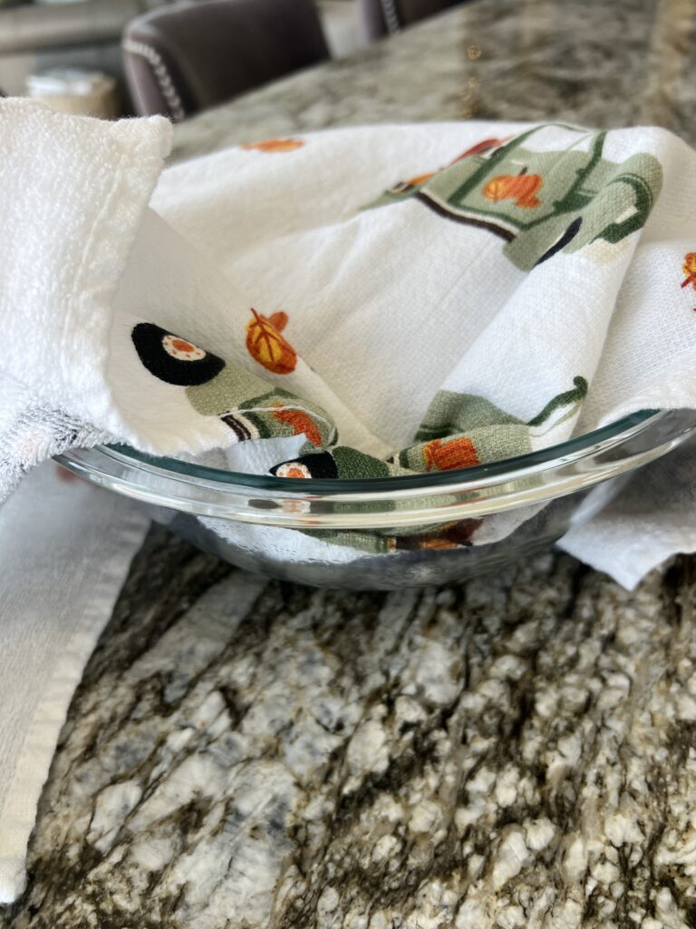 Chestnuts covered in towel after boiling